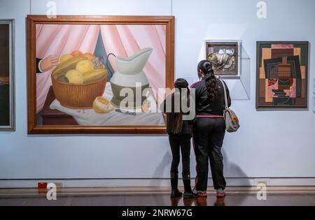 Women observing `Still Life´, by Fernando Botero. Modernities hall, National Museum of Colombia, Bogota, Colombia Stock Photo